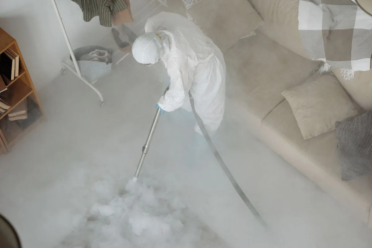 Biohazard cleanup technician in protective equipment, White Castle, LA